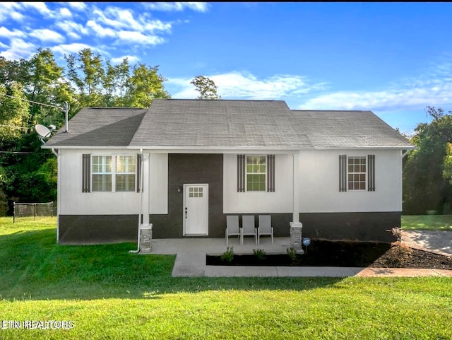 view of front of property with a patio area and a front yard