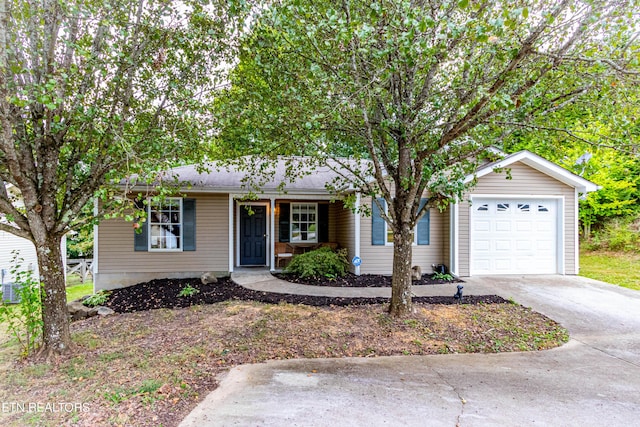 ranch-style house with concrete driveway and a garage