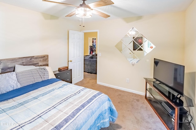 bedroom with carpet flooring, a ceiling fan, and baseboards