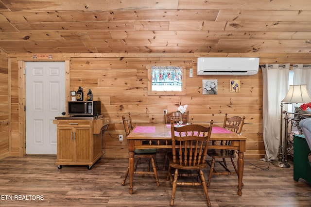 dining area with wood ceiling, an AC wall unit, hardwood / wood-style floors, and wood walls