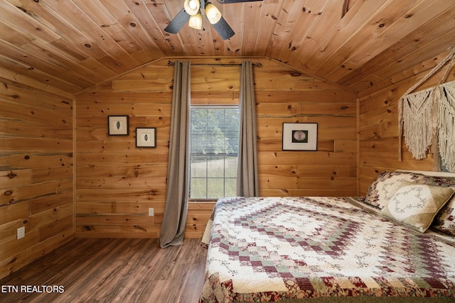 bedroom featuring vaulted ceiling, hardwood / wood-style floors, wooden walls, and wooden ceiling