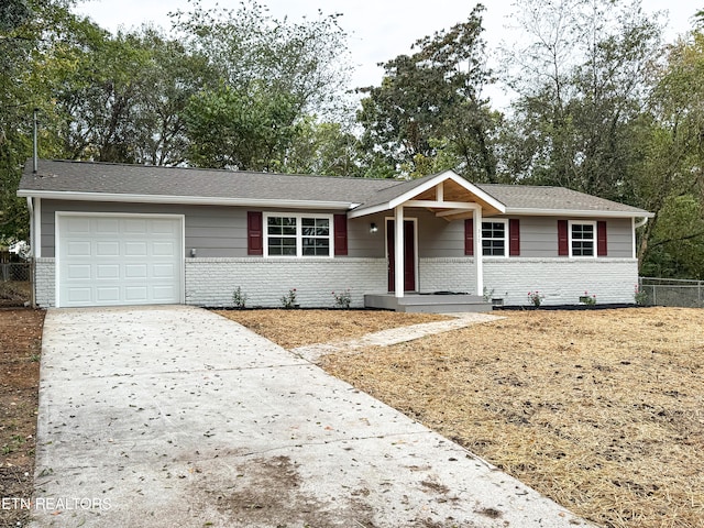 ranch-style home featuring a garage and a porch