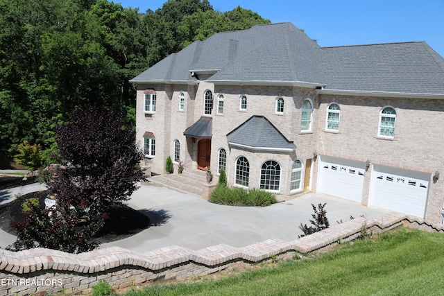 french country home with a garage