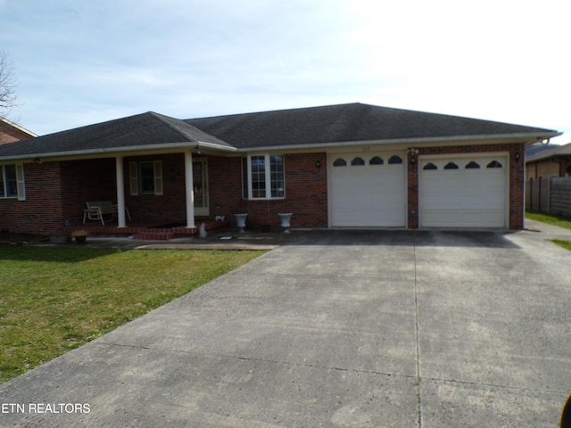 single story home with a garage and a front yard