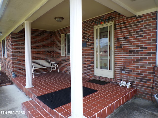 view of patio featuring a porch