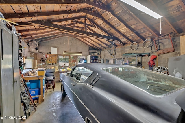 garage with concrete block wall