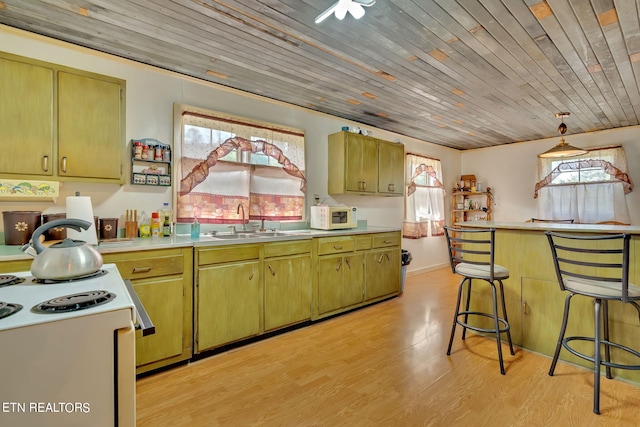 kitchen with wooden ceiling, light countertops, a sink, and light wood-style flooring