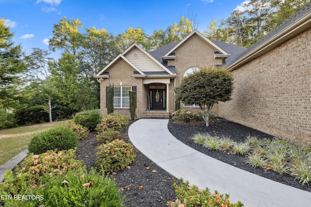 view of front of home with brick siding