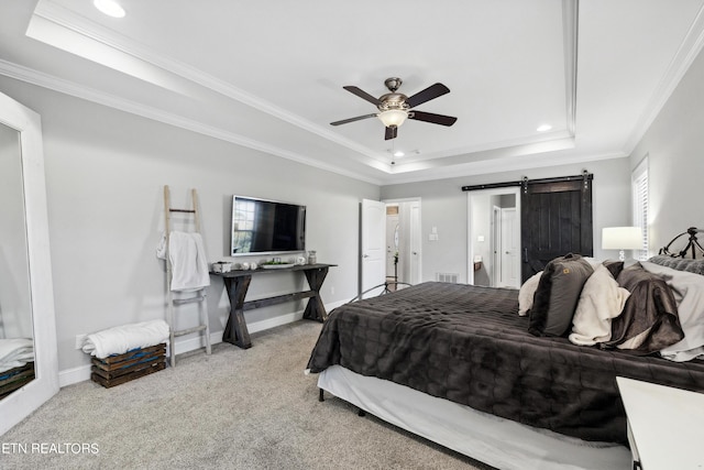 bedroom with a raised ceiling, carpet floors, and crown molding