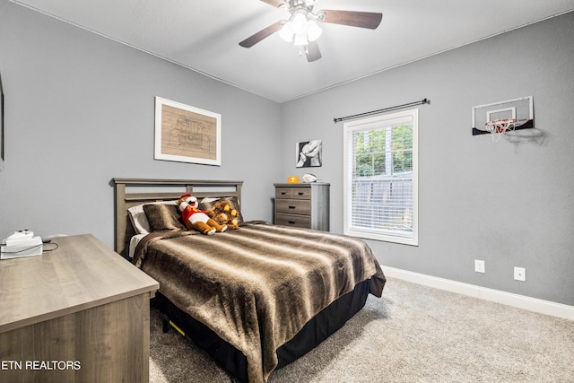 bedroom with baseboards, carpet flooring, and a ceiling fan