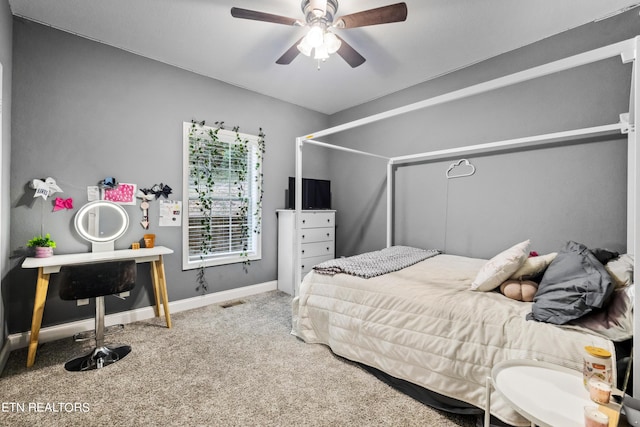 bedroom featuring baseboards, visible vents, carpet, and a ceiling fan