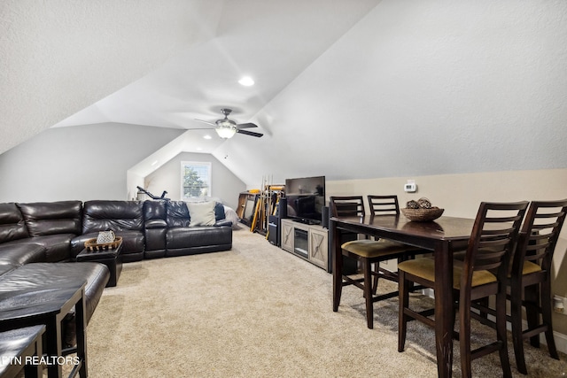 living room featuring lofted ceiling, ceiling fan, recessed lighting, and light colored carpet
