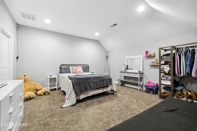 carpeted bedroom featuring visible vents, lofted ceiling, and recessed lighting