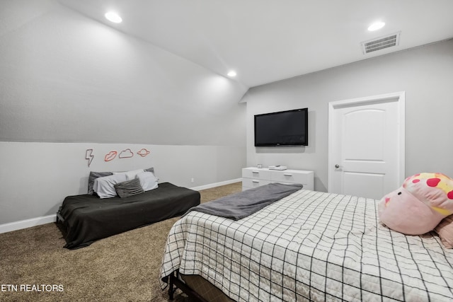 bedroom featuring baseboards, visible vents, vaulted ceiling, and carpet