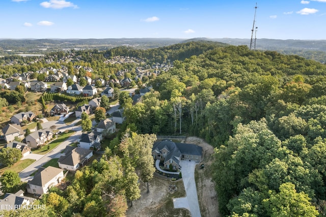 aerial view featuring a view of trees and a residential view