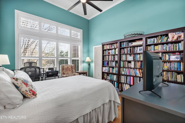 bedroom featuring hardwood / wood-style flooring and ceiling fan