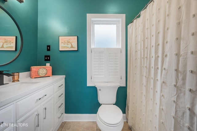 bathroom with tile patterned flooring, vanity, toilet, and a shower with shower curtain