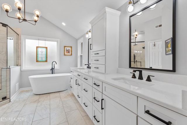 bathroom featuring plus walk in shower, vanity, an inviting chandelier, and vaulted ceiling