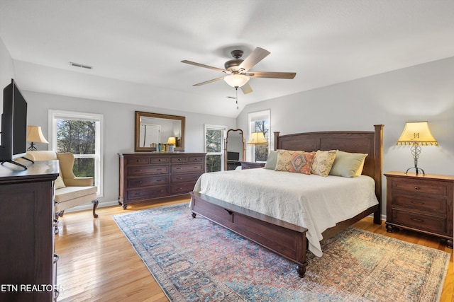 bedroom with ceiling fan and light hardwood / wood-style floors