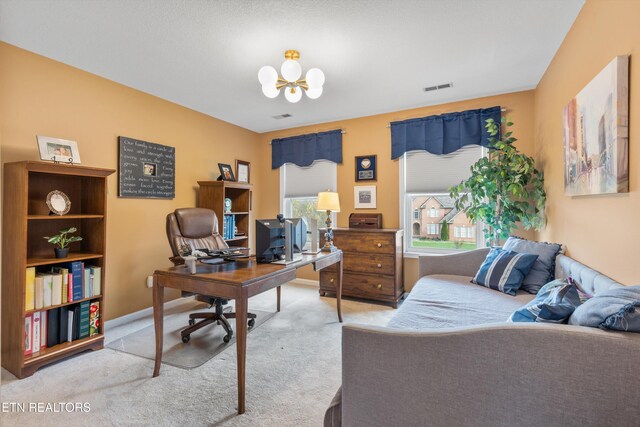 carpeted office space with a notable chandelier