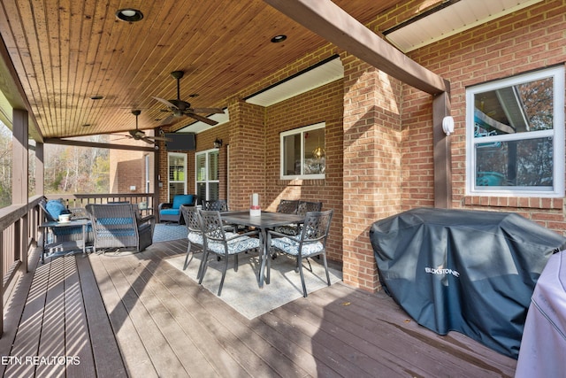 wooden terrace with ceiling fan, an outdoor living space, and grilling area