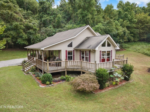 view of front of home with covered porch and a front yard