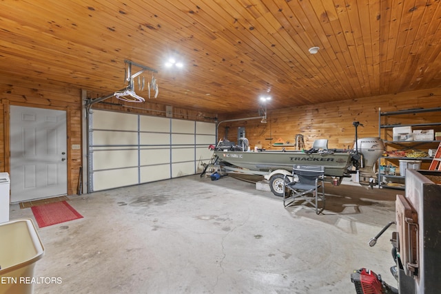 garage with wood walls, a garage door opener, and wooden ceiling