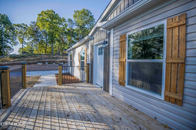 wooden deck with a patio