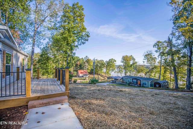 view of yard with a wooden deck