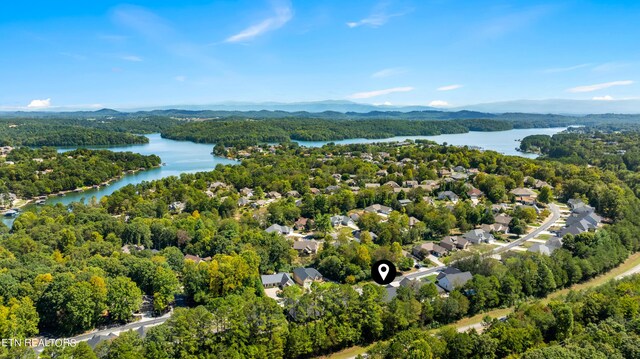 aerial view featuring a water and mountain view