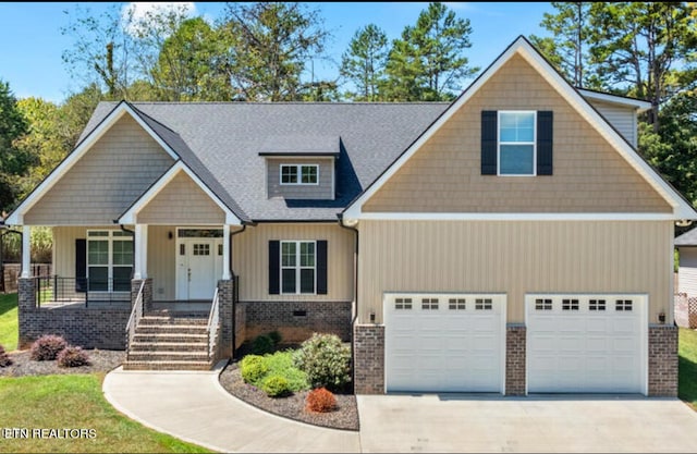 craftsman house featuring a garage and a porch