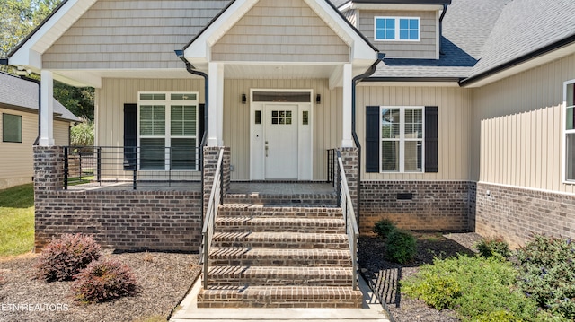 view of exterior entry featuring a porch