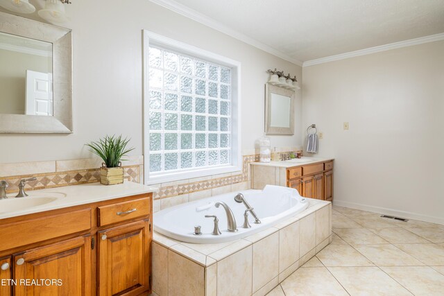 bathroom featuring a wealth of natural light, crown molding, tiled bath, and vanity