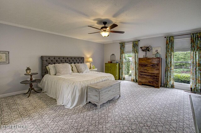 bedroom featuring multiple windows, ceiling fan, ornamental molding, and a textured ceiling