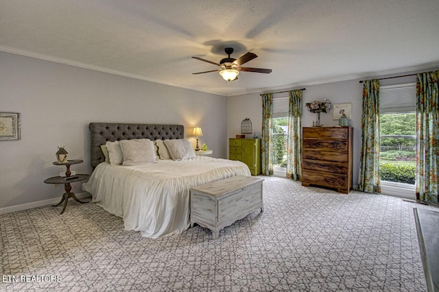 bedroom featuring light carpet, a textured ceiling, crown molding, and baseboards