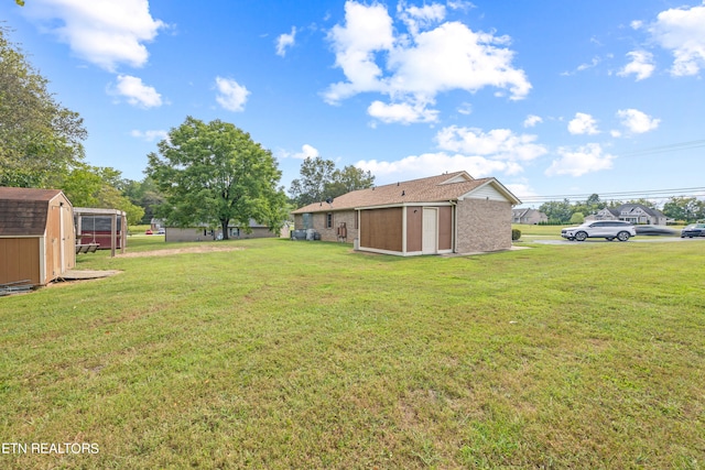 view of yard with a storage shed