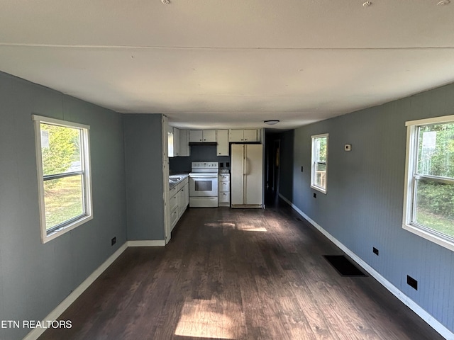 unfurnished living room featuring dark wood-type flooring