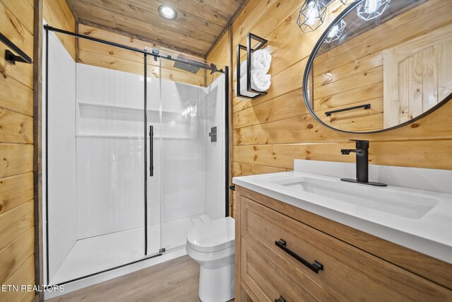 bathroom with vanity, wood walls, an enclosed shower, wood ceiling, and toilet