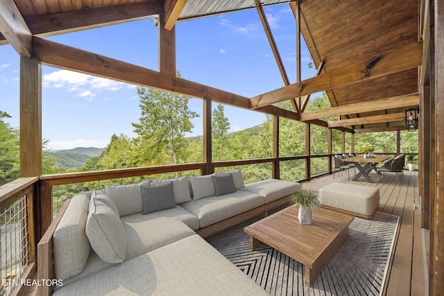 wooden terrace featuring an outdoor hangout area