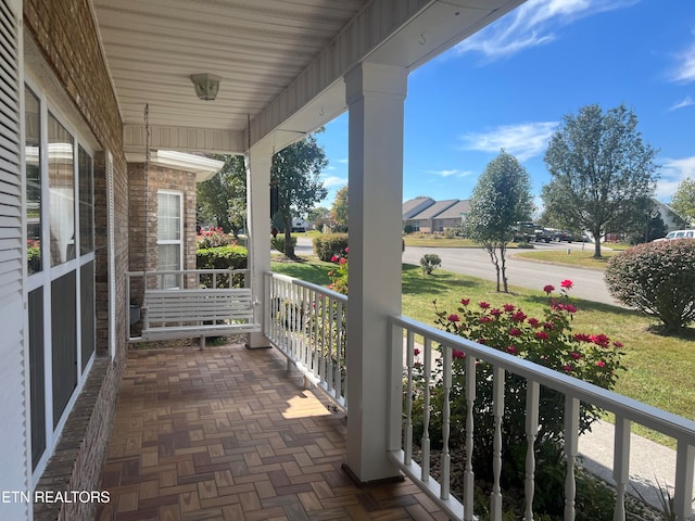 balcony featuring covered porch