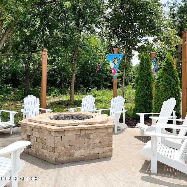 view of patio / terrace featuring an outdoor fire pit