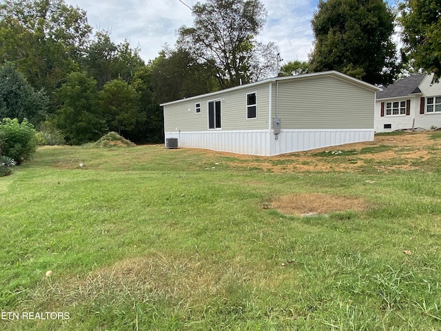 view of yard with central AC