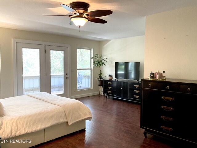 bedroom featuring access to exterior, dark wood-style flooring, and a ceiling fan