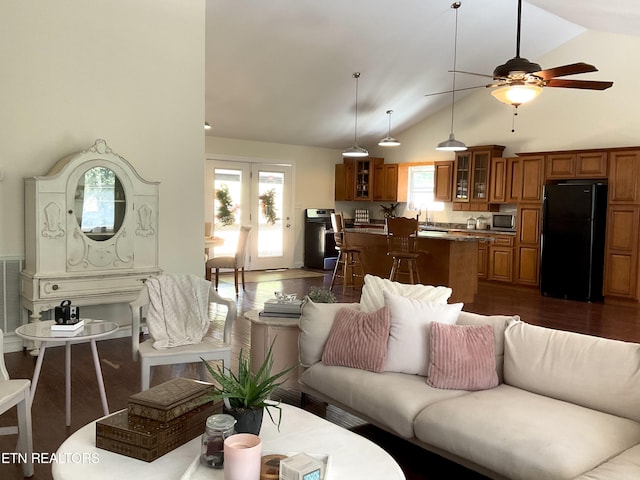 living area featuring a ceiling fan, high vaulted ceiling, dark wood-style flooring, and french doors