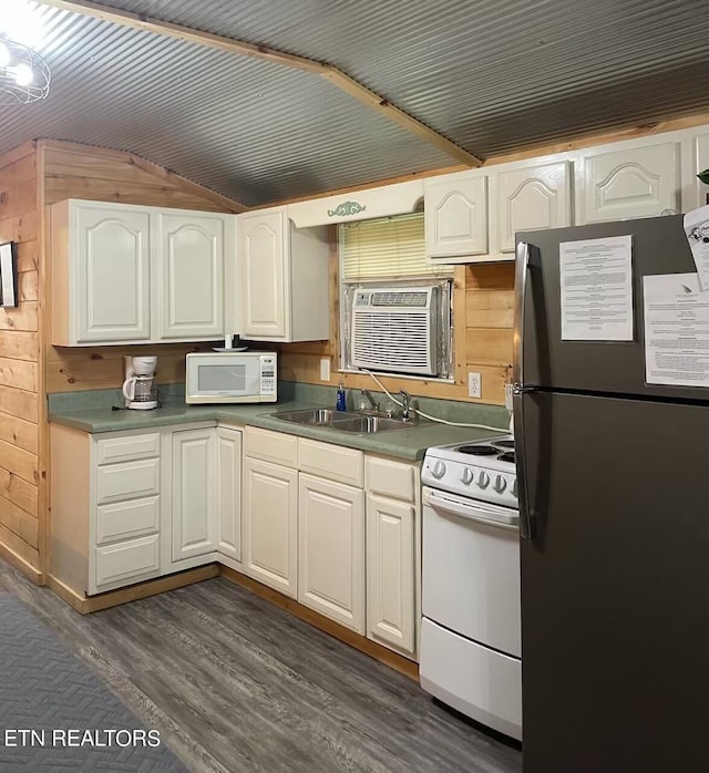 kitchen with white appliances, white cabinetry, a sink, and dark wood-style flooring