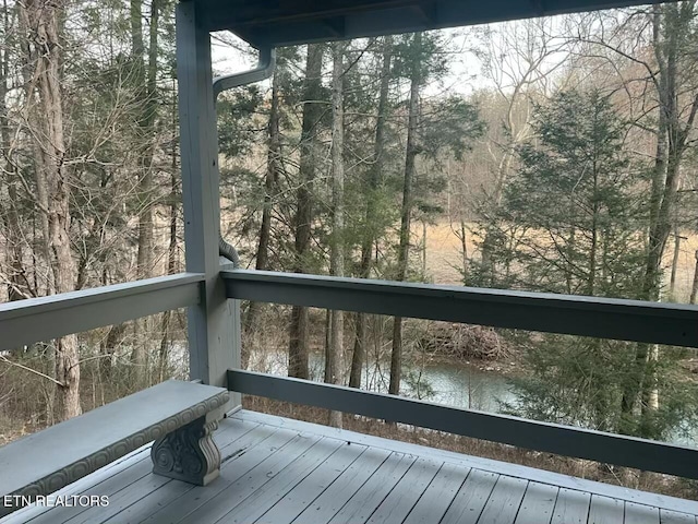 wooden terrace with a water view