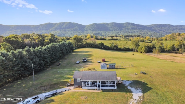 birds eye view of property featuring a mountain view and a rural view