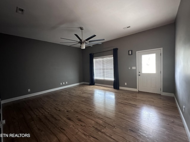 entrance foyer with baseboards, wood finished floors, visible vents, and ceiling fan