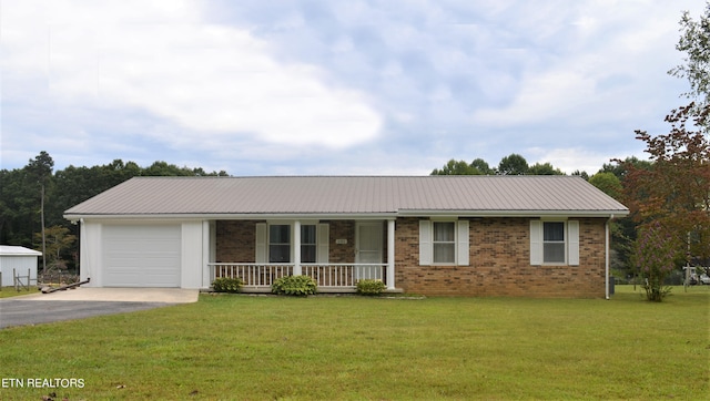 ranch-style home featuring a garage, a front lawn, and a porch