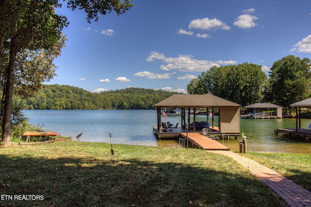 108 Waynoka Ln, Loudon, TN 37774 - view of dock featuring a water view, a yard, boat lift, and a forest view